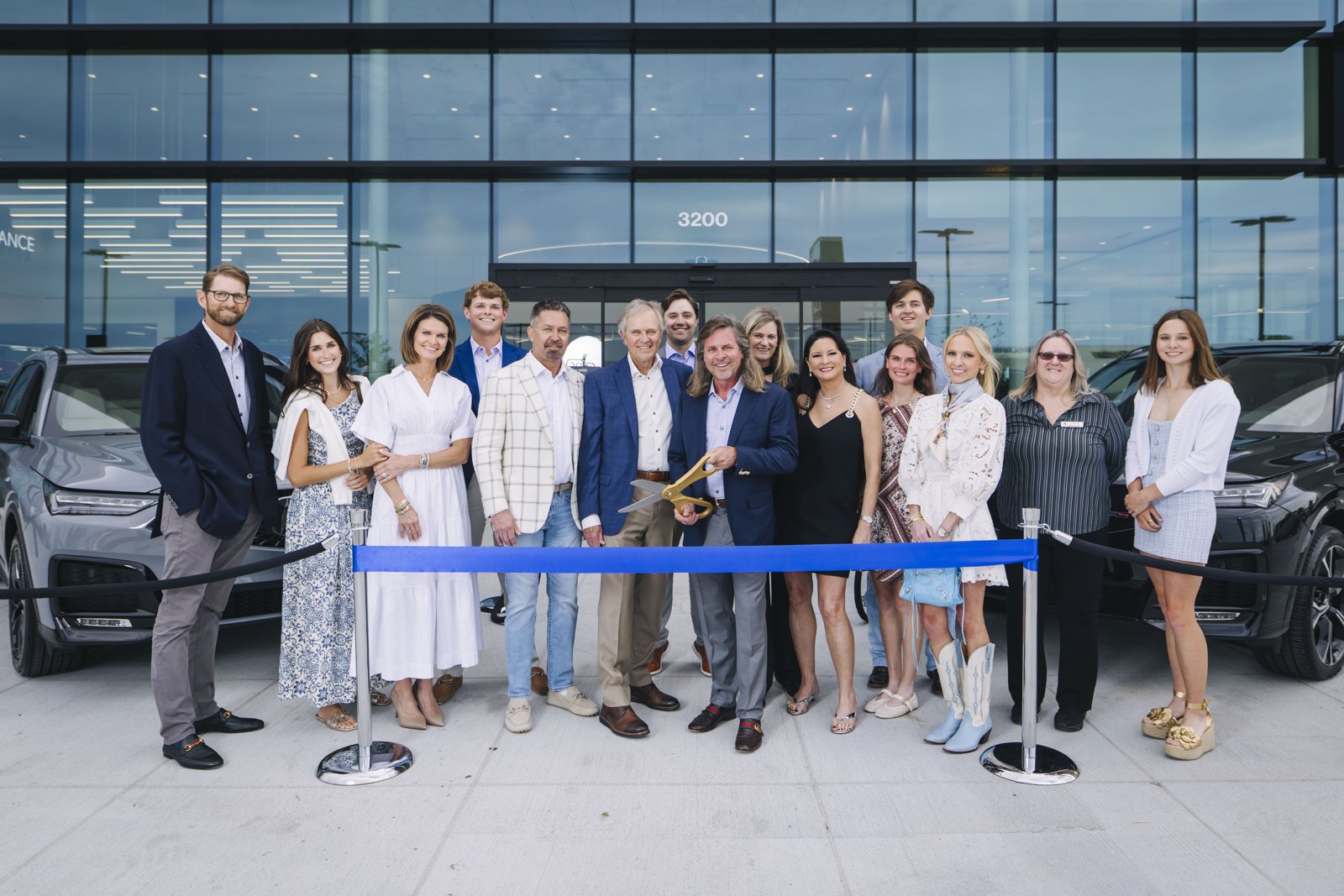 Hiley family and team members at a blue ribbon cutting